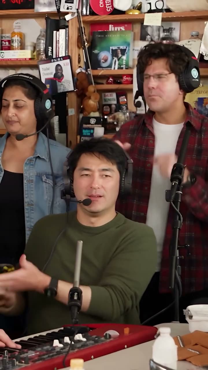 Frame at 2 seconds from the Vellm example video made from test photos: the band shot, with the keyboard lead in a green sweater and two singers in the back row.