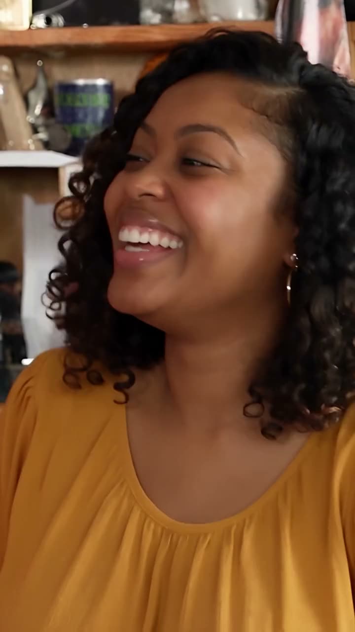 Frame at 8 seconds from the Vellm example video made from test photos: the close-up singer in a yellow blouse laughing.