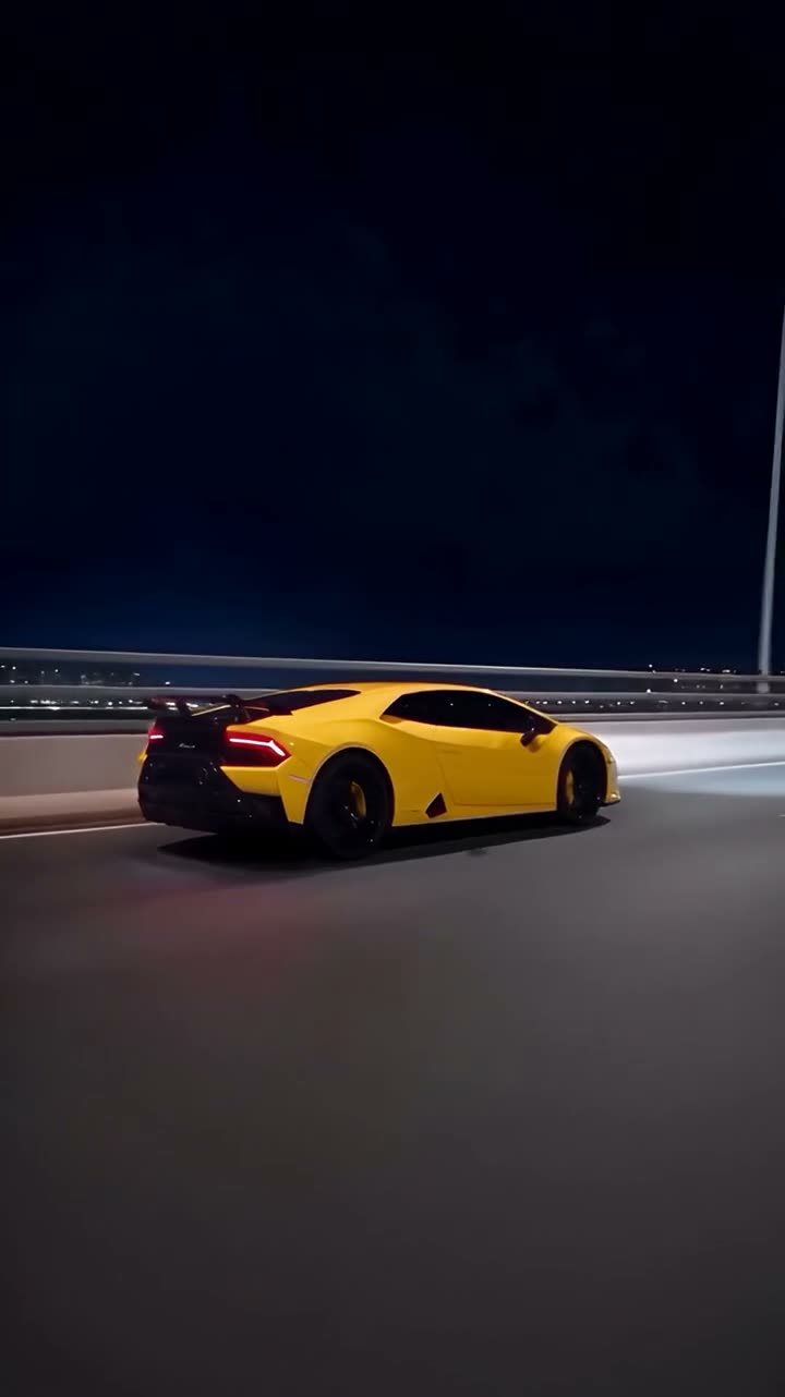 Frame at 10 seconds from the Vellm example video made from test photos: the full-size yellow car drives on a night road after the tunnel.